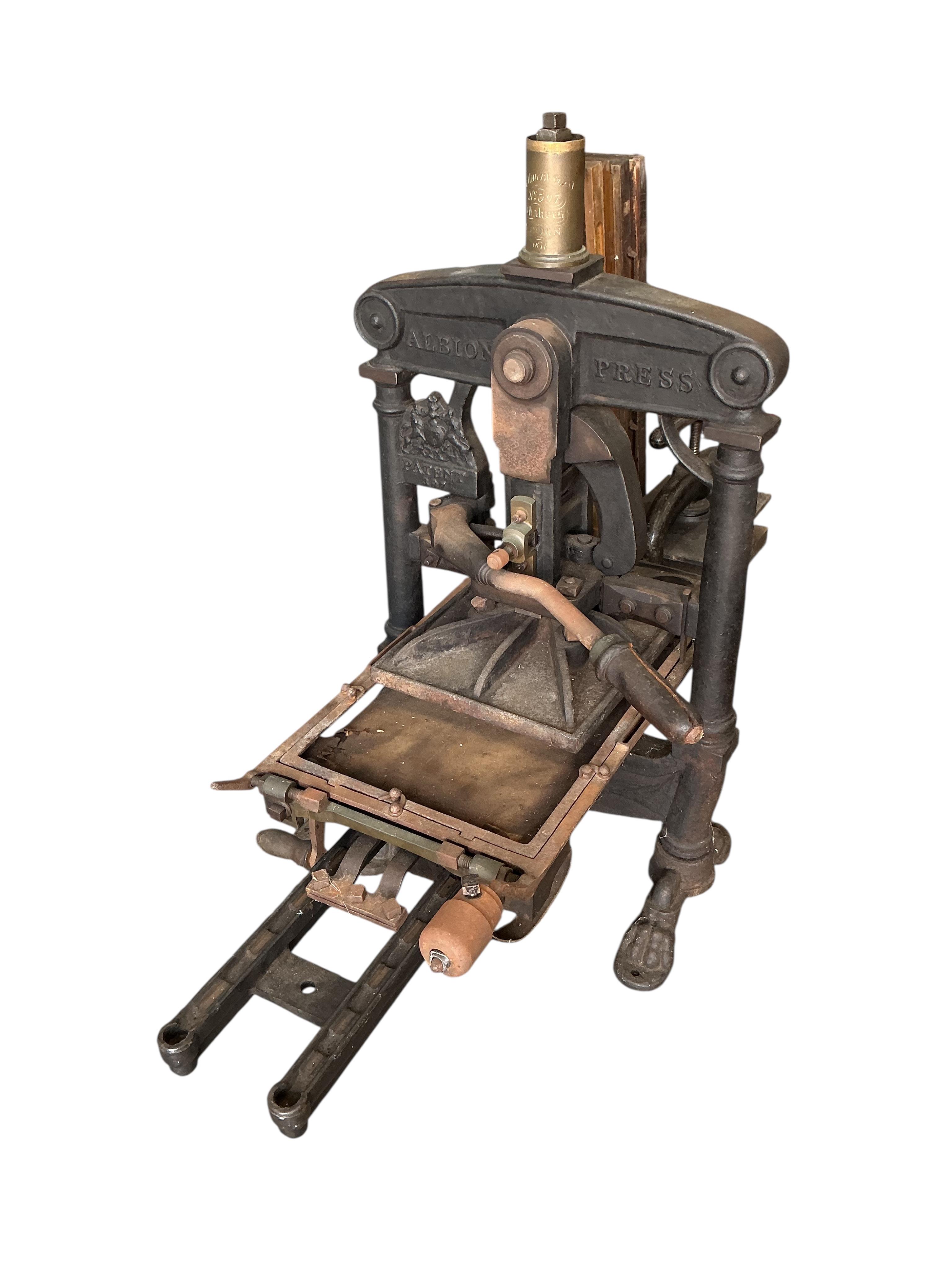 A large Victorian Albion cast iron printing press (for restoration),dated 1851, width 88cm, height 100cm. Provenance: This was the property of the printmaker and designer Jeffery Matthews.